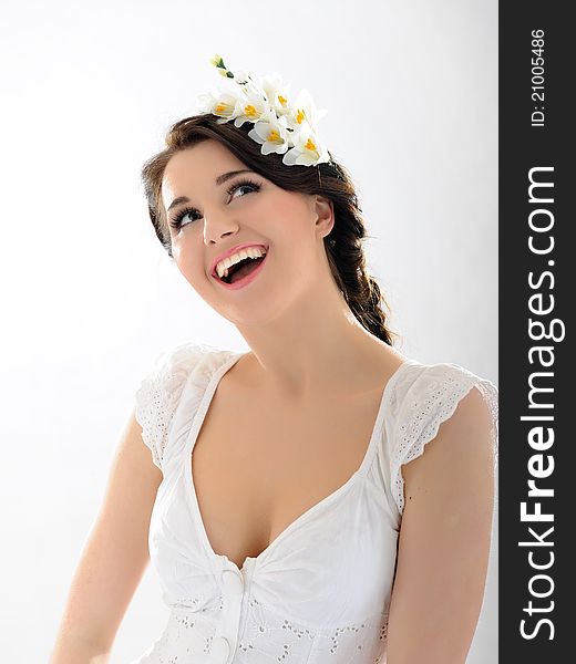 Beautiful fresh spring woman with flowers in her hair