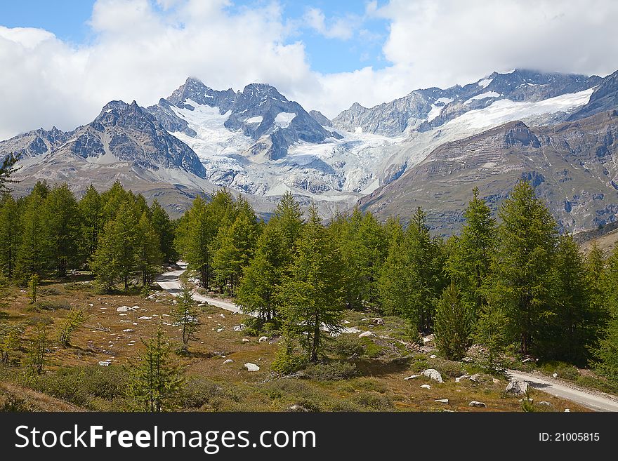 High alpine hiking route near famous mountain Matterhorn (peak Cervino)