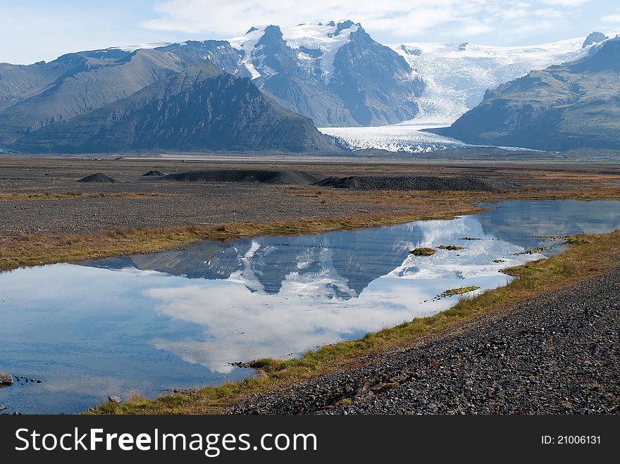 Vatnajokull glacier reflected in a river. Vatnajokull glacier reflected in a river