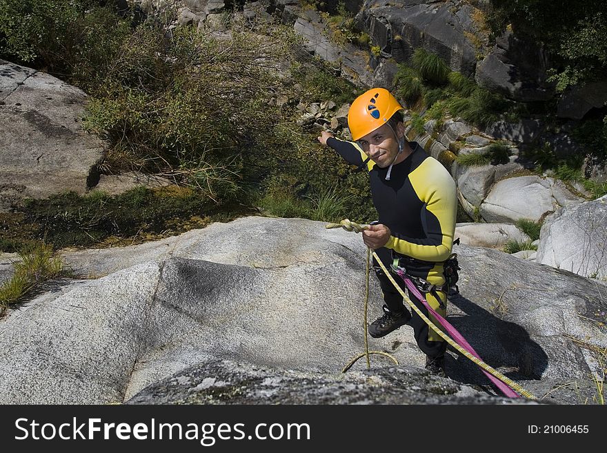 The intructor of canyoning show the water. The intructor of canyoning show the water