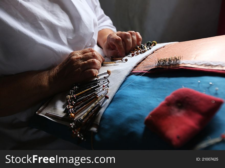 Old woman making Bobbin lace making