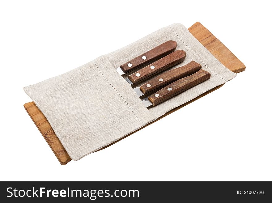Set of knifes for serving on wooden board, isolated