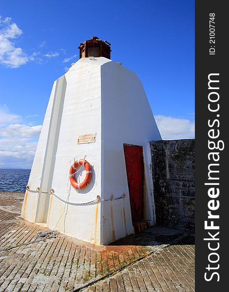 Lighthouse on pier at Burghead, Moray, Scotland. Lighthouse on pier at Burghead, Moray, Scotland