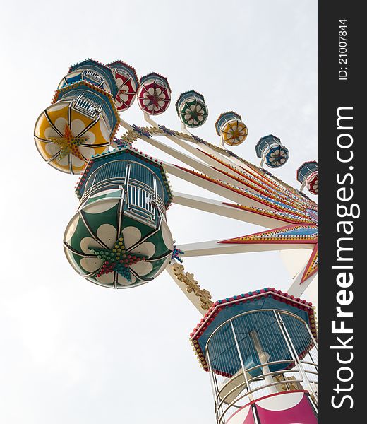 A section of a brightly colored Ferris wheel