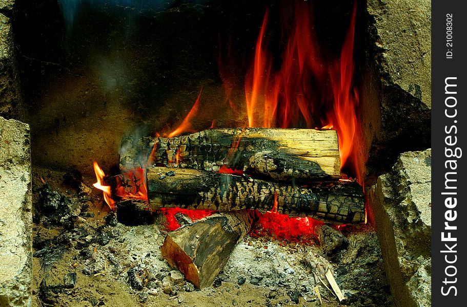 Burning logs in a campfire.  Number 4 of 6.