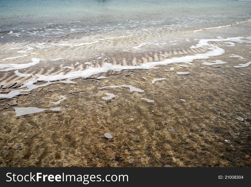 Coastline of dead Sea with salt on banks. Coastline of dead Sea with salt on banks