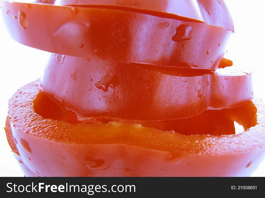 Sliced red pepper in detail with water drops