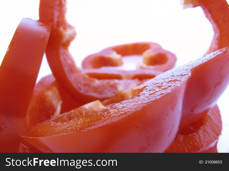 Sliced red pepper in detail on white background