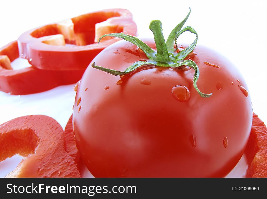 Red tomato and sliced red pepper