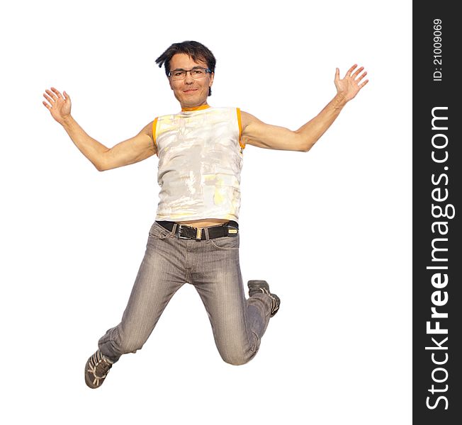 Happy young man jumping in air with arms extended isolated on white background. Happy young man jumping in air with arms extended isolated on white background
