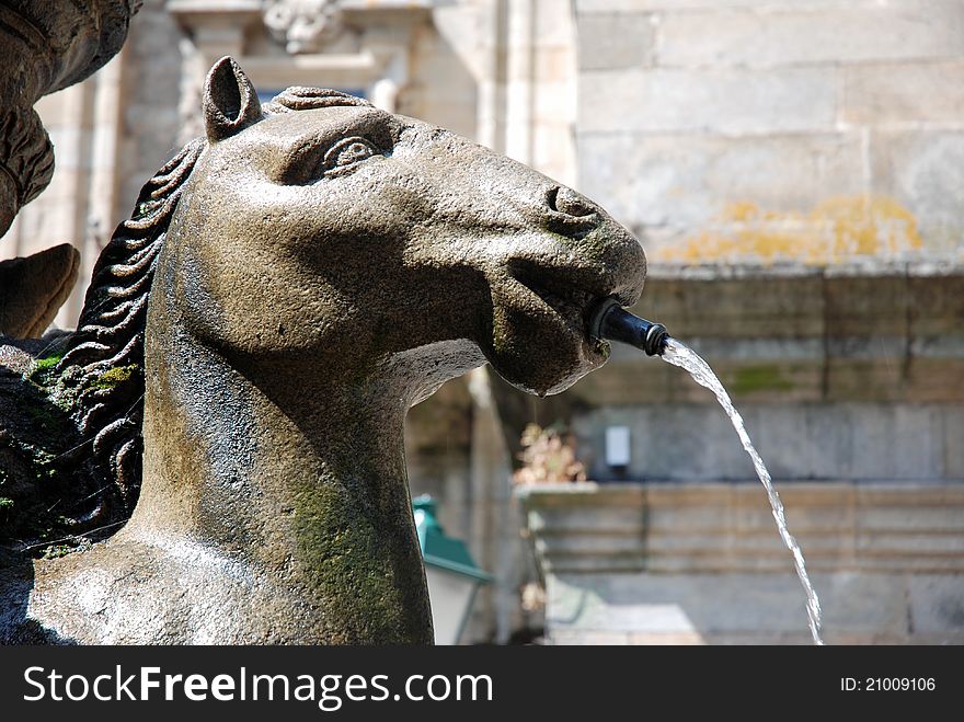 View of a detail of a horse figure on a fountain in Santiago de Compostela, Galicia (Spain). View of a detail of a horse figure on a fountain in Santiago de Compostela, Galicia (Spain)