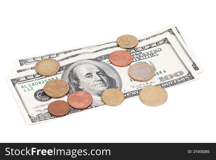 Coins over hundred dollar bills - isolated on white background. Coins over hundred dollar bills - isolated on white background