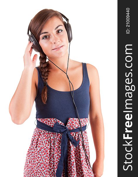 Young woman listening to music, isolated over white background