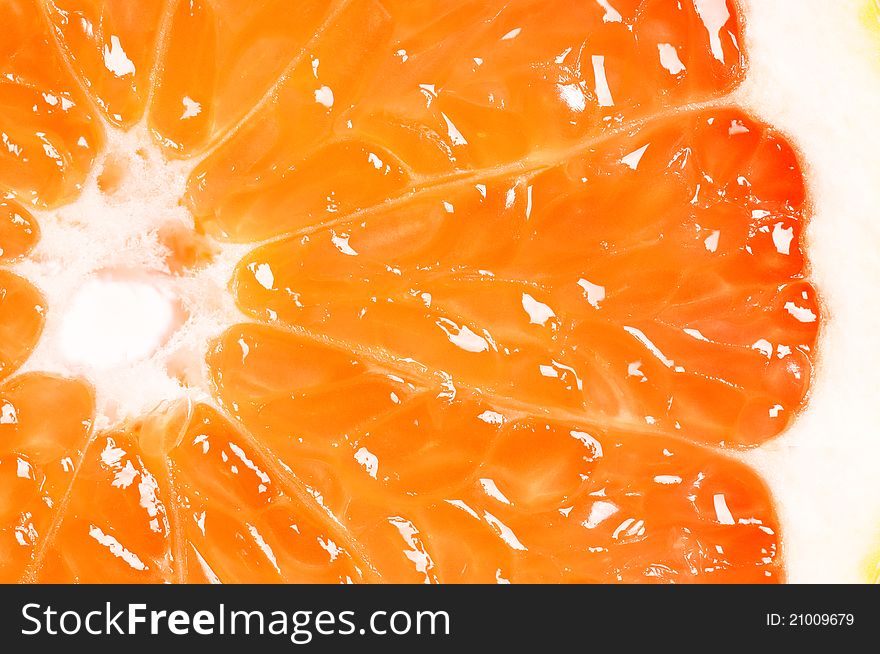 Close up half of ripe grapefruit. Food background.