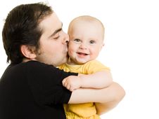 Father Kissing Daughter Stock Photo