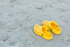Bright Yellow Flip-flops On Sand Beach Royalty Free Stock Photography Bright Yellow Flip-flops On Sand Beach Royalty Free Stock Photography