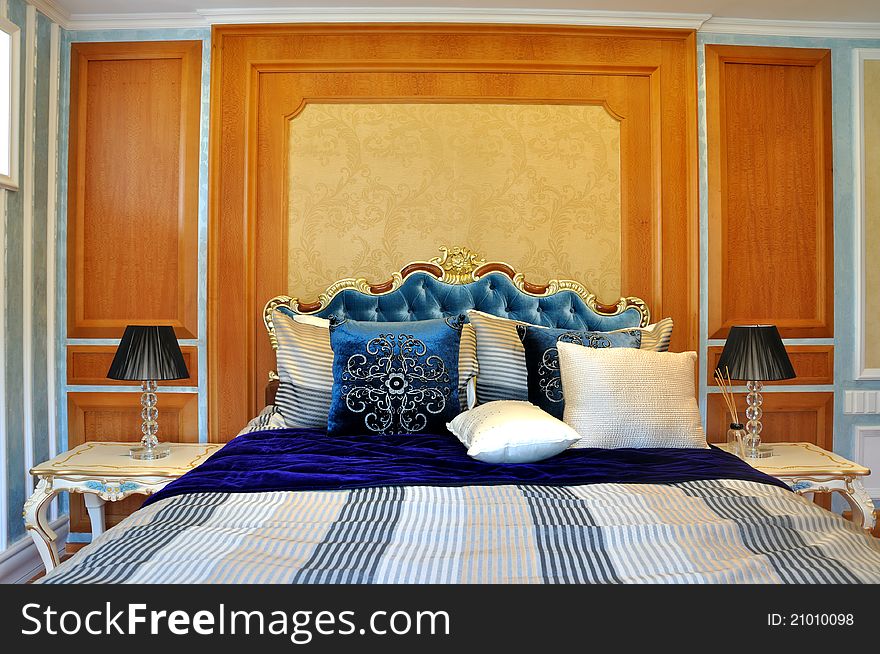 Lively and interesting color matching decoration bedroom internal, with yellow and brown wall and blue bedding. Lively and interesting color matching decoration bedroom internal, with yellow and brown wall and blue bedding.