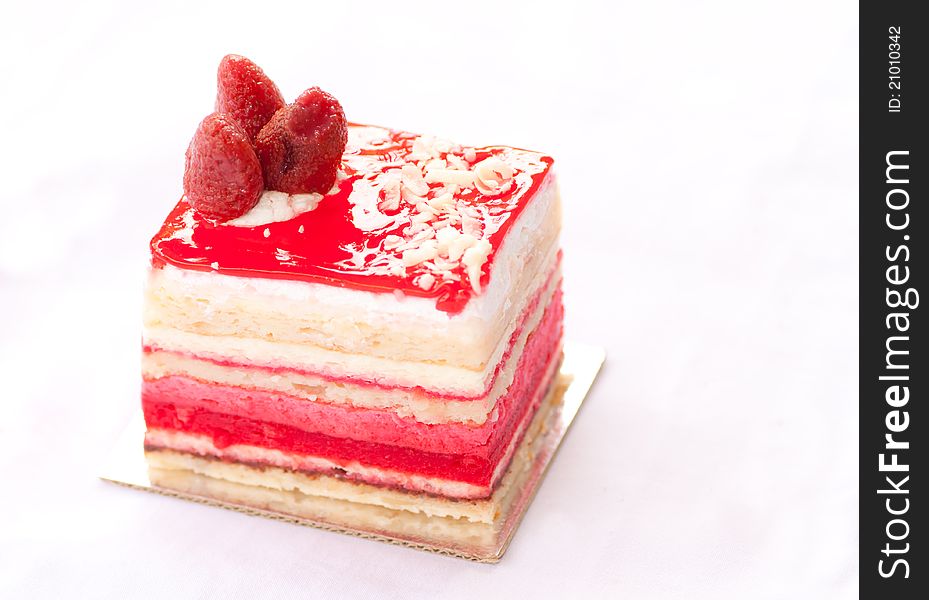 Almond strawberry cake isolated on white background