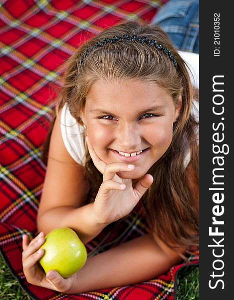 Portrait of little girl with green apple outdoor. Portrait of little girl with green apple outdoor