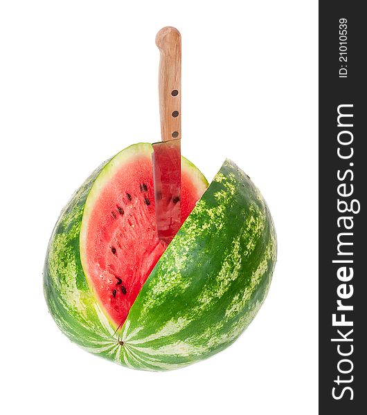 Knife in watermelon on white