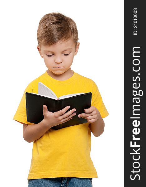 Portrait of little schoolboy with book on white background. Portrait of little schoolboy with book on white background