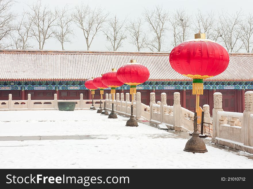 Red lanterns in front of the palace, snow in winter