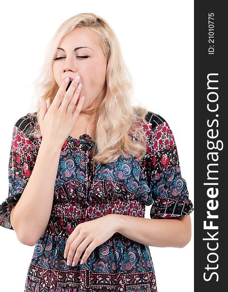 Portrait of a tired young woman yawning - isolated on white background. Portrait of a tired young woman yawning - isolated on white background