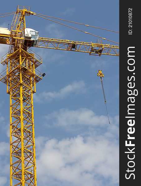 Building crane over blue sky