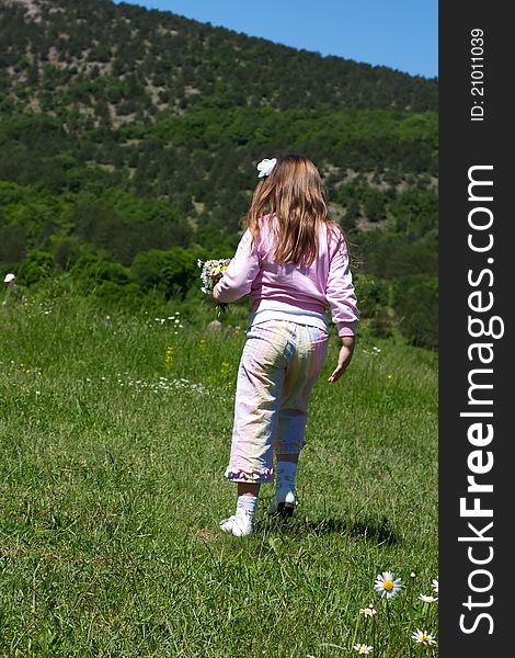 Little girl running on a  meadow. Little girl running on a  meadow