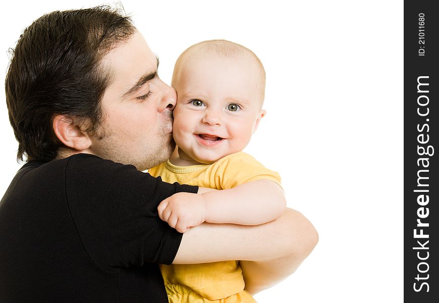 Father kissing daughter on a white background.