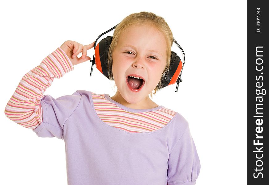 Little girl listening to music on white background