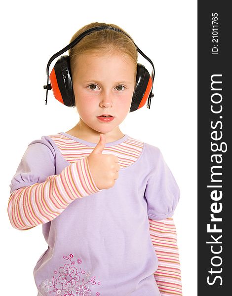 Little girl listening to music on white background