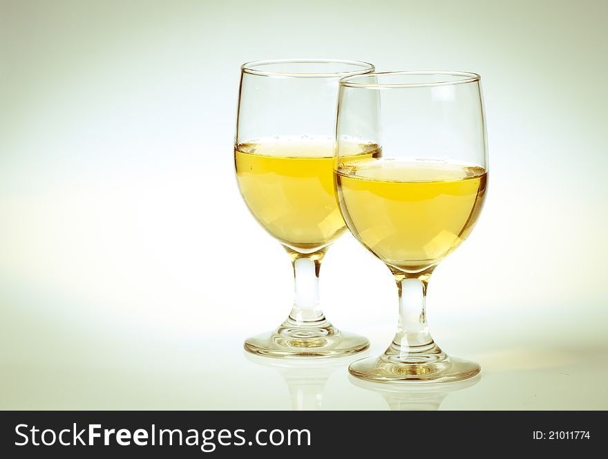 Glass of white wine Isolated on a white background. Glass of white wine Isolated on a white background.