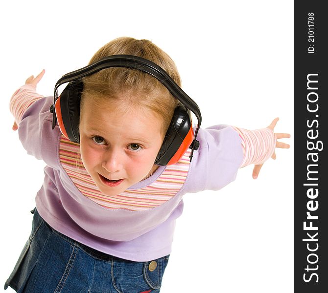 Little girl listening to music on white background