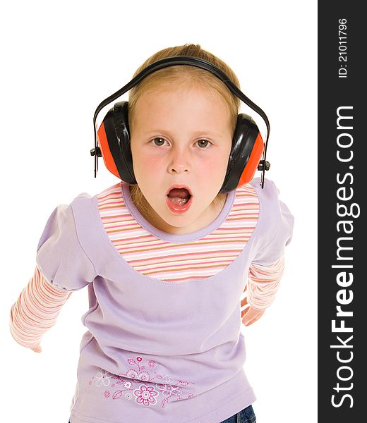 Little girl listening to music on white background