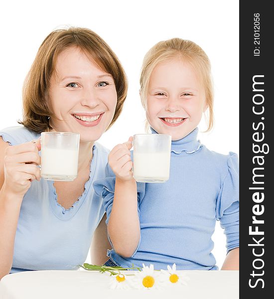 Mom and daughter drink milk.