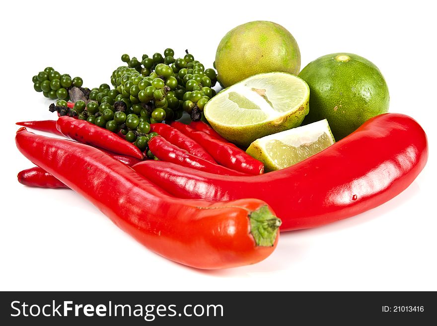 Mix food ingredient chili peppercone and lime on the white background. Mix food ingredient chili peppercone and lime on the white background