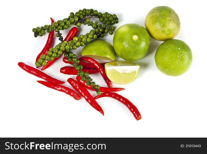Mix food ingredient chili peppercone and lime on the white background. Mix food ingredient chili peppercone and lime on the white background