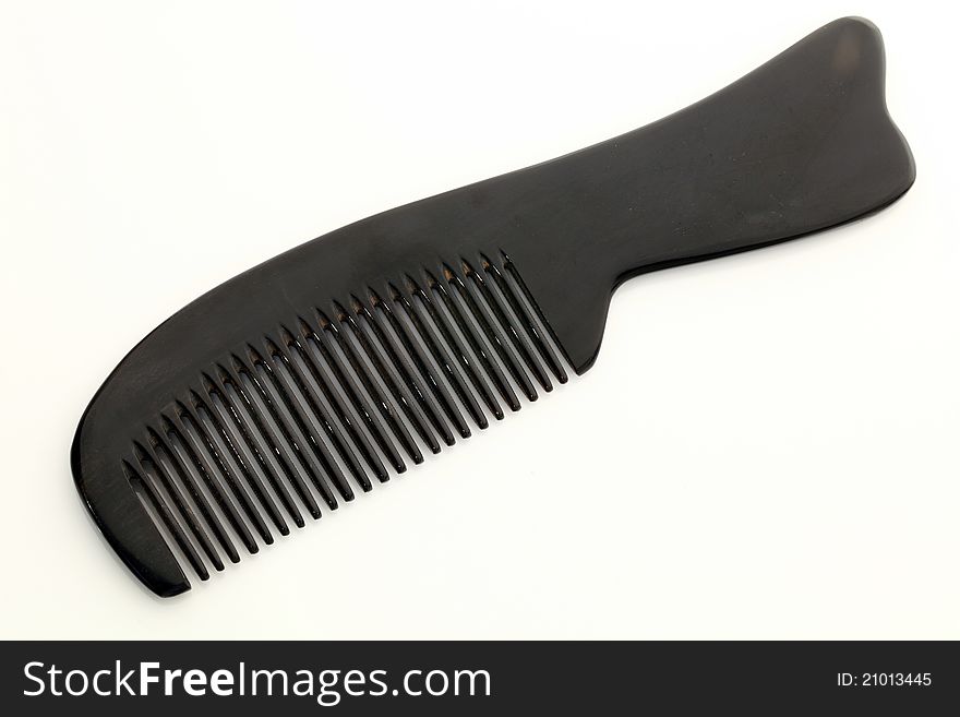 Black comb on a white background.