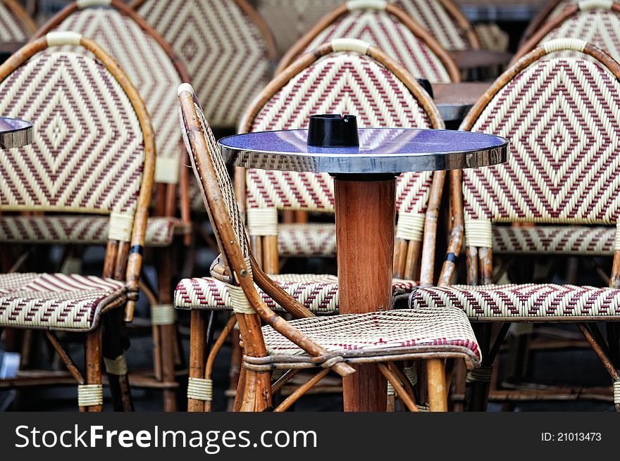 Wicker chairs and tables in the street cafe in Paris