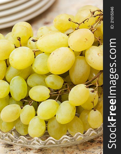 A plate of fresh and sweet green grapes