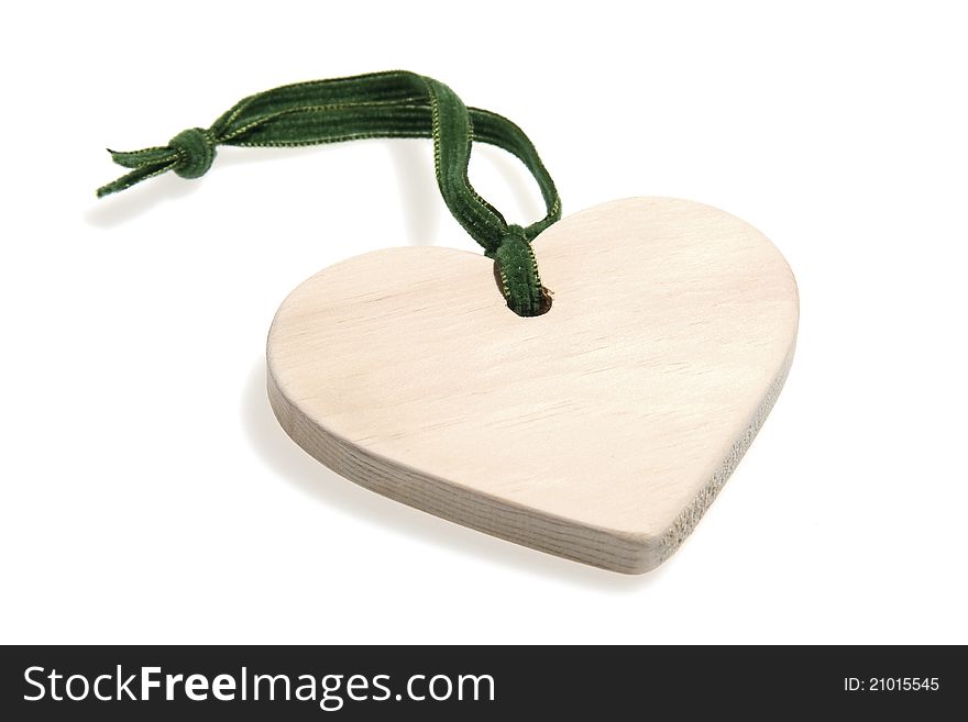 Wooden heart with green ribbon