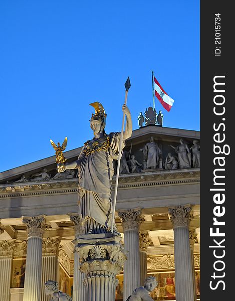 Statue of pallas athene in front of the austrian parliament in vienna at night. Statue of pallas athene in front of the austrian parliament in vienna at night