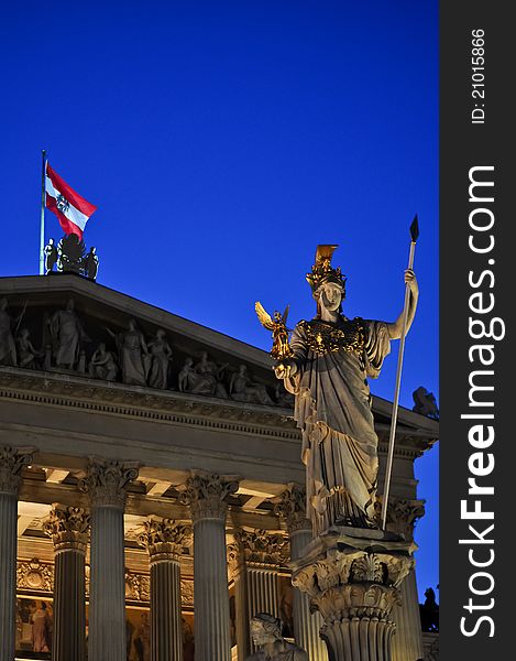 Statue of pallas athene in front of the austrian parliament in vienna at night. Statue of pallas athene in front of the austrian parliament in vienna at night