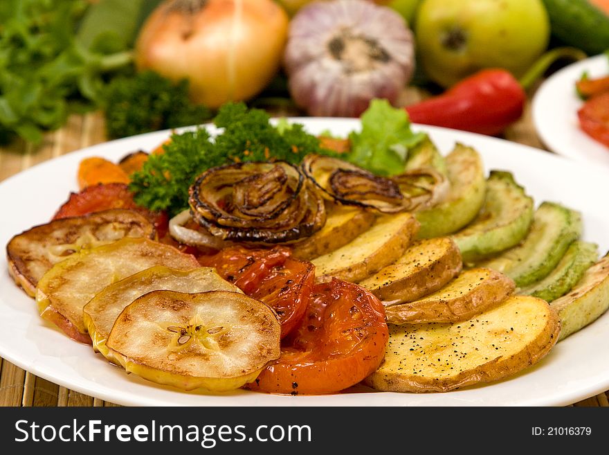 Baked vegetables on plate. Vegetarian food