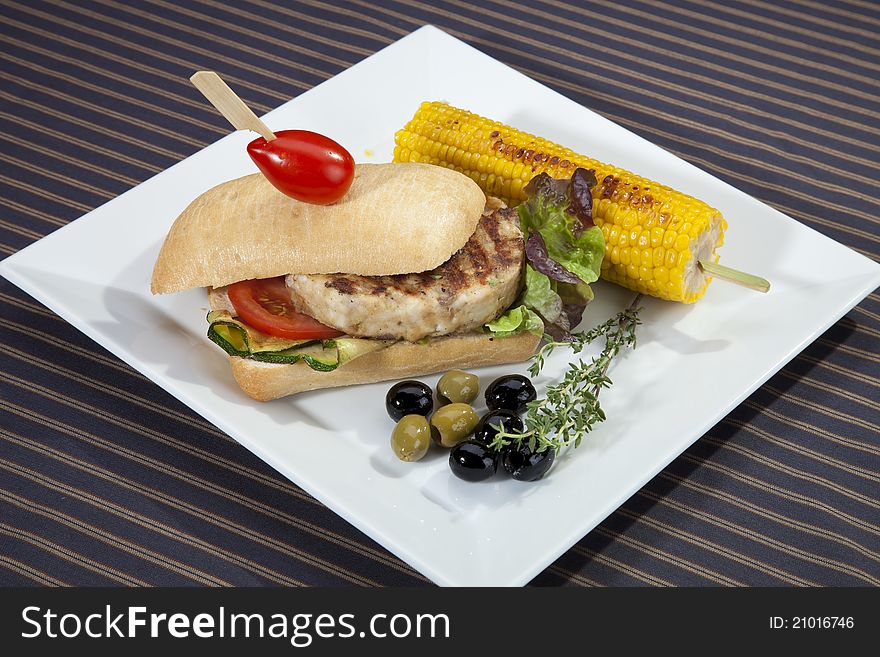 Sandwich w meat grilled corn aubergine and olives. Sandwich w meat grilled corn aubergine and olives