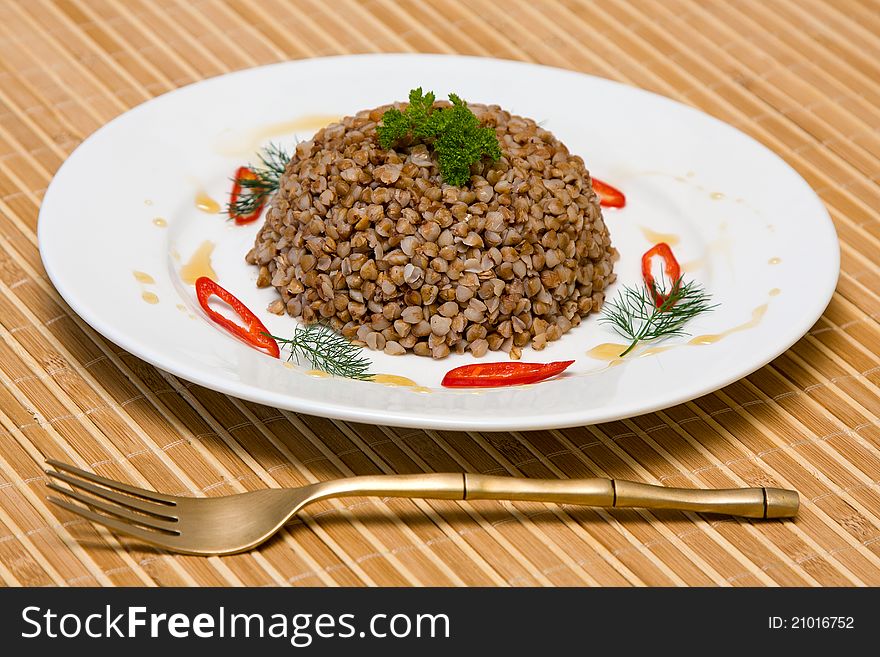 Food background. The boiled buckwheat porridge closeup. Food background. The boiled buckwheat porridge closeup.