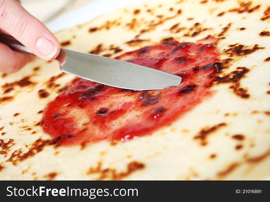 Closeup with appetizing pankakes with strawberry jam