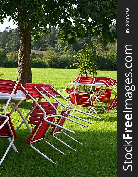 Chairs and tables of an empty beer garden in an idyllic environment