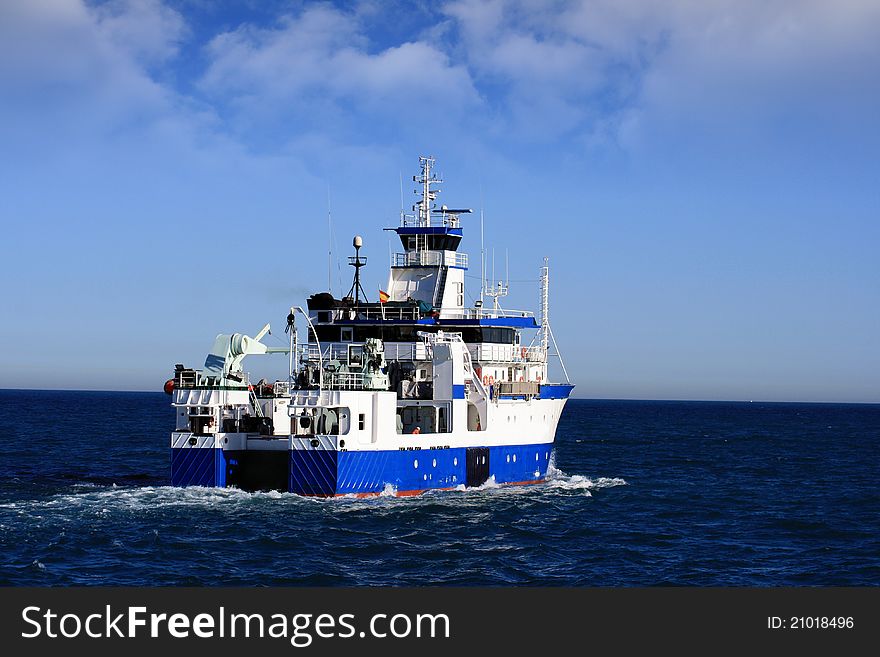 Oceanographic ship departing to the open waters
